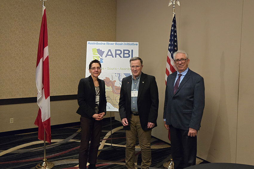Dr. Allan Preston (centre) poses with Manitoba Beef Producers' board member Maureen Cousins (left) and MP Larry Maguire (right)