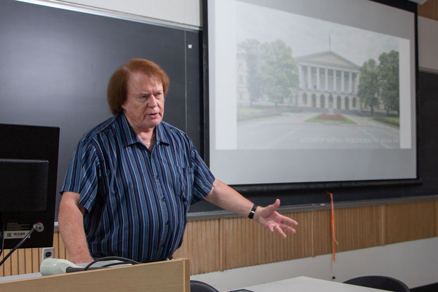 Instructor at the front of a classroom