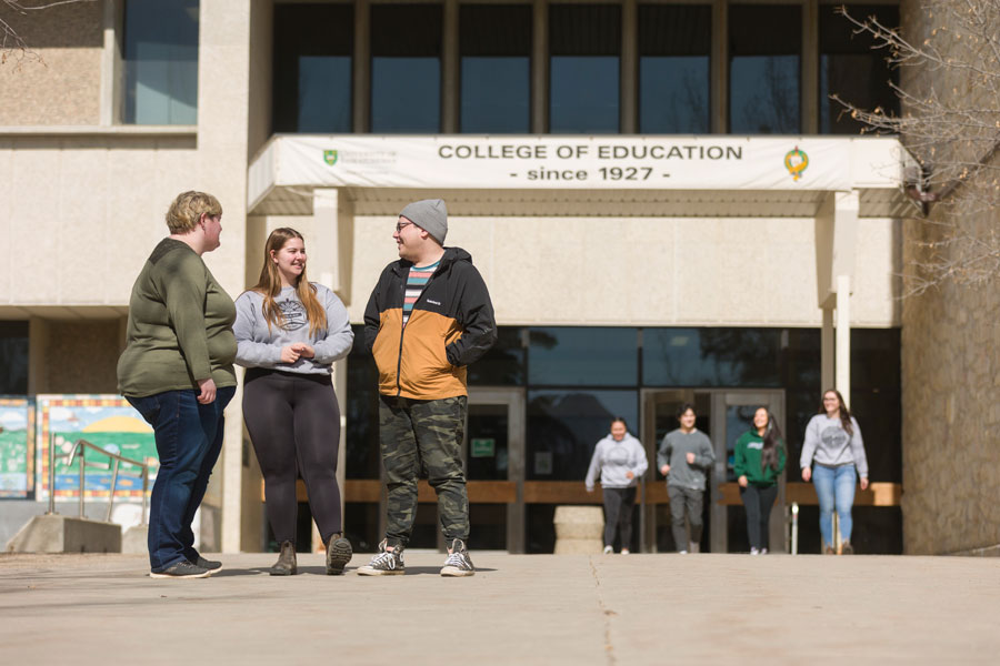 Students standing in front of the College of Education building on USask campus