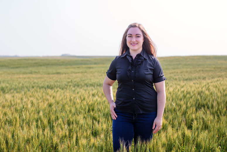 Kaitlin Kelly standing in a field