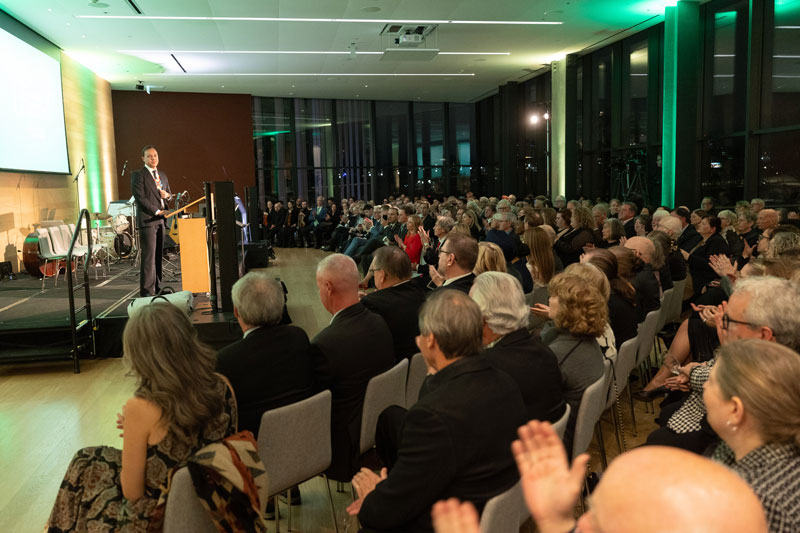 Renowned Canadian artist Phil Richards and USask President Peter Stoicheff are pictured beside the president’s official painted portrait. (Photo: David Stobbe)