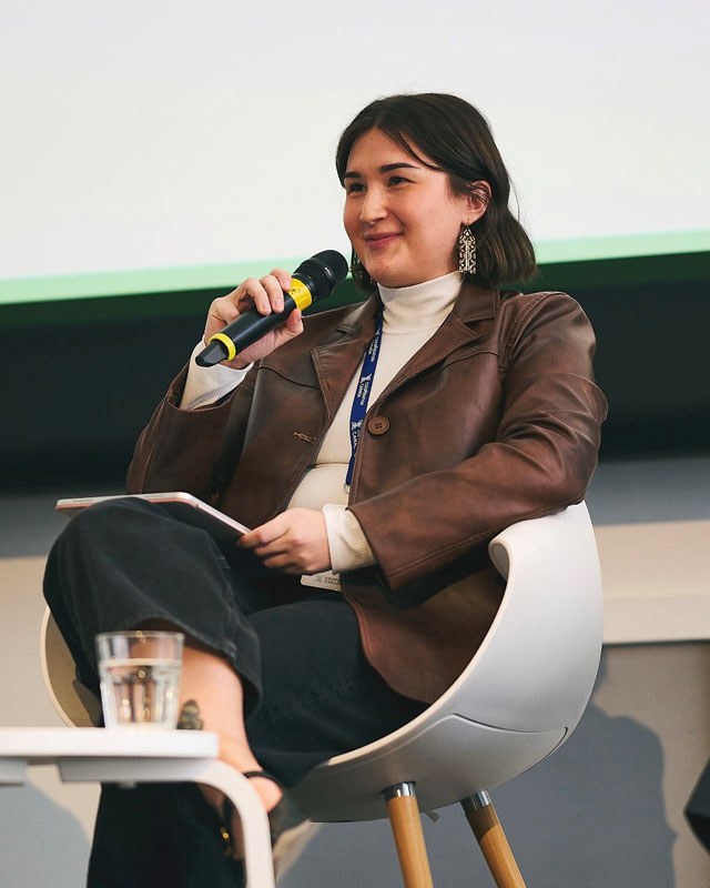 USask graduate Kate Gillis (MA’24) is pictured at the most recent United Nations Framework Convention on Climate Change (UNFCCC) Conference of the Parties in Brazil, where she was asked to speak on behalf of the North America Indigenous Peoples socio-cultural region. (Photo: Submitted)